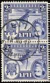 385 385 C 1938 55 3d blue vertical pair used with Nadroga CDS of 12 JUL 45, lower stamp with R4/2 spur on medallion (just clear of postmark). Difficult so fine.