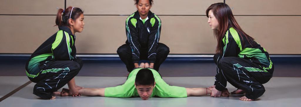 Three to four assistants lift the athlete up to feet (0-0 cm) off the flo, one grasping The athlete begins lying face down on the floor, legs and feet togeth r, arms extended the athlete by the top